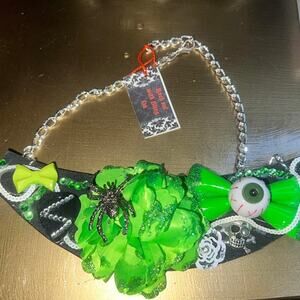 Statement necklace.  Kelly green flower, eye, bowtie and spider.  Glitter/sequin